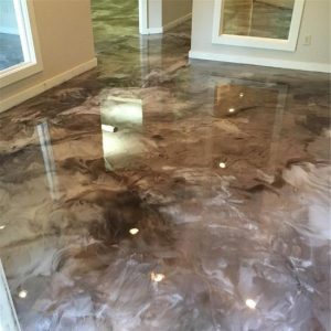 marble floor in a house that has been painted brown and white with light reflecting on it
